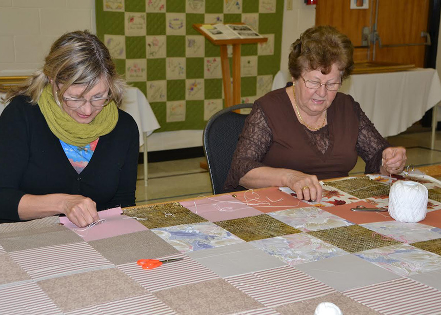 Making comforters for Ukraine refugees a community effort